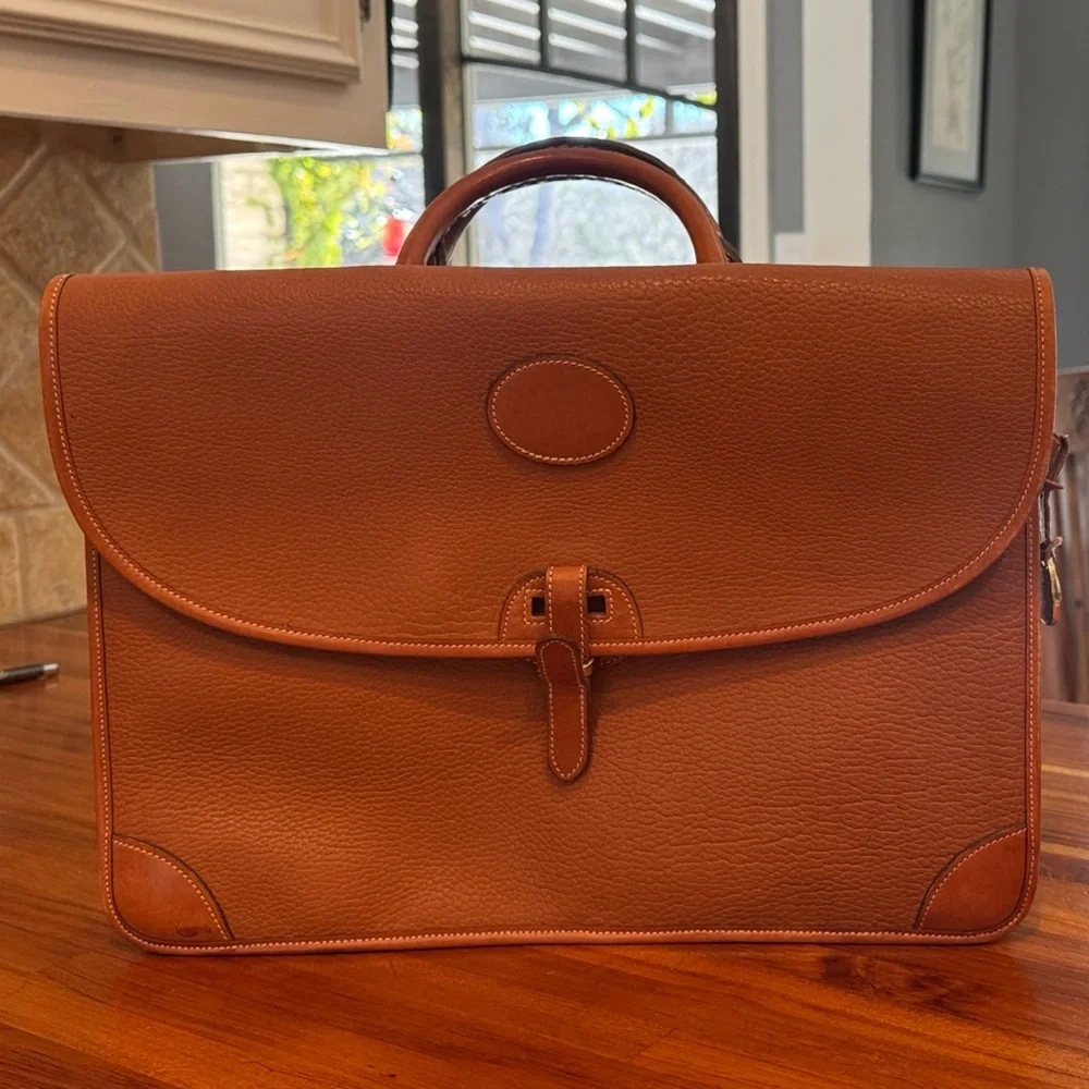 Vintage camel colored Dooney and Bourke all weather leather briefcase/laptop bag